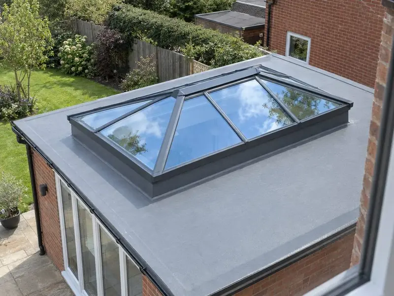 Rectangular aluminium roof lantern on the flat roof of a brick rear extension