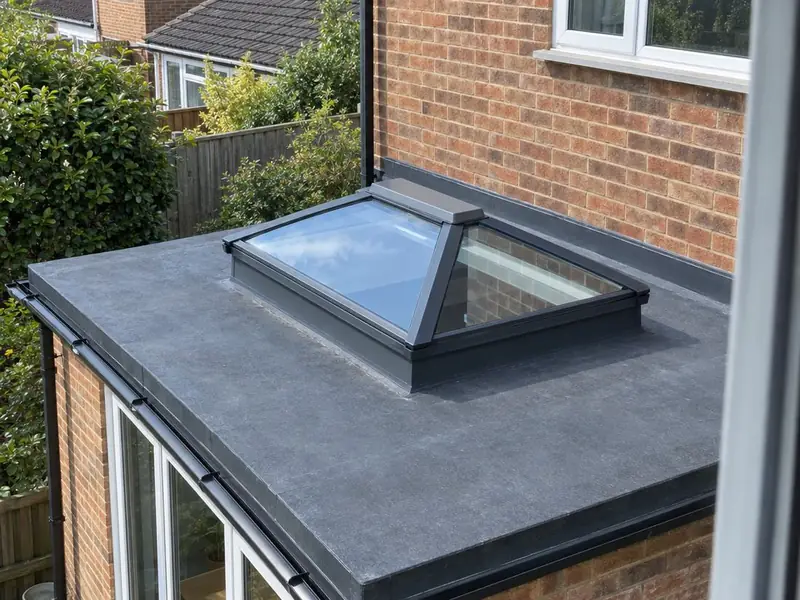 Small hipped roof lantern on the flat roof of a side extension