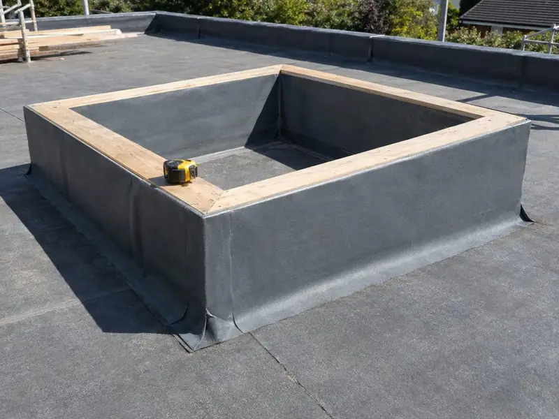Timber kerb upstand wrapped in roofing membrane, ready for a lantern